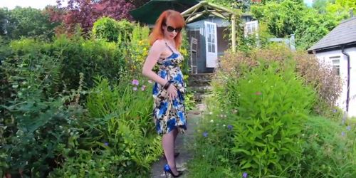 Busty girl Red XXX fingers herself in the garden