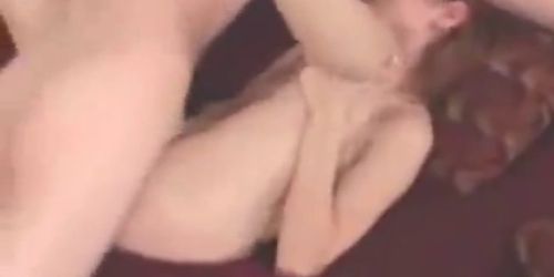 Redhair amateur copulating on a sofa