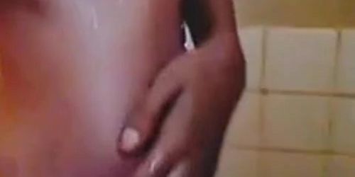 Hairy pussy 18-year-old ebony with salty clit takes a shower