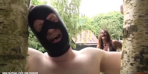 Mistress in latex ties slave to tree and whips him before suck and screw bbc