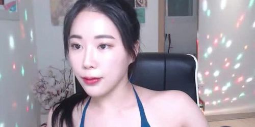 Beautiful Asian camgirl in swimsuit shows her body