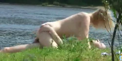 Swinger couple starts fucking on public nude beach