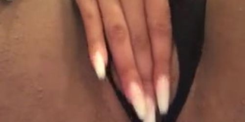 Sexy ebony with long nails playing on camera