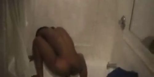 Sexy black girl in shower has dildo action