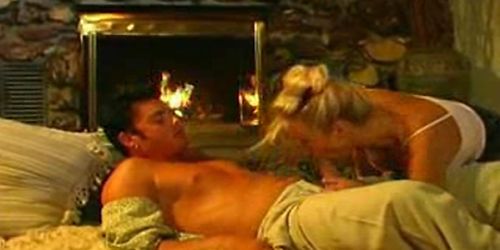 Blonde MILF does her Best By The Fireplace