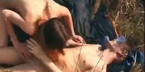 Handsome guy kisses lips of cute teen girl