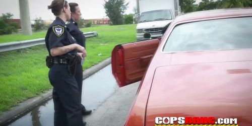 Huge shlong get sucked in public by two stunning big breast cops