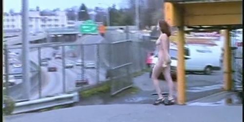 Tall Nude Girl Walks in Urban Area