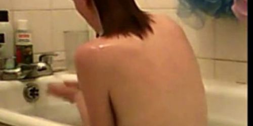 Cute teen caught in bath - video 1