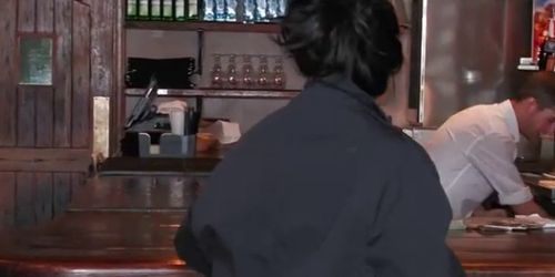 Business woman strips for bartender on the bar