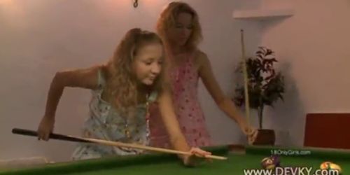 Girls licking on the billiards table