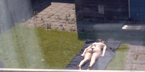 Sunbathing (Partly Topless)