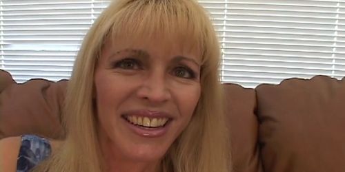 MILF Nicole Moore sucks on a long thick cock