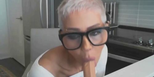 Short haired mature woman fucks her dildo