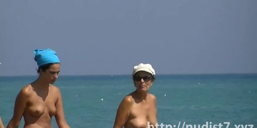 NUDIST VIDEO - Sexy beach nudist women putting on lotion caught by spy cam - video 2