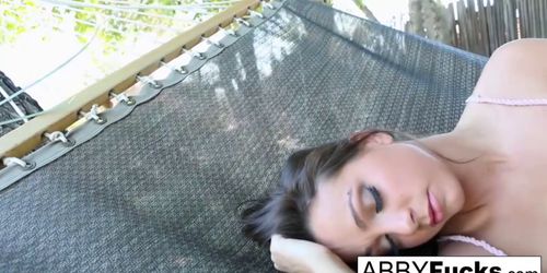 Abigail masturbates while relaxing on hammock