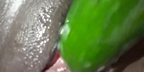 Fucking this tight pussy with a cucumber 