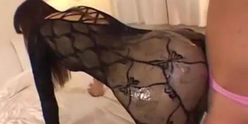 Dominant asian girl with oiled bodystocking