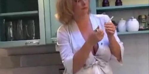 Amazing big boobs on the smoking housewife