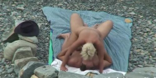 Blonde wife rides her hubby's cock on the beach