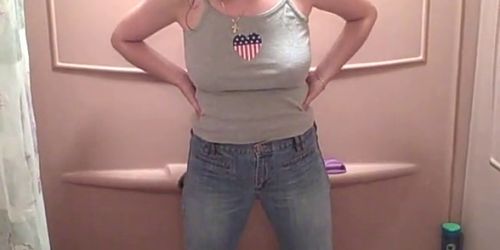 Busty MILF pissing in her pants