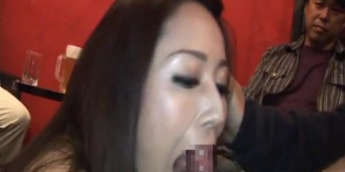 Bar girl gets busy sucking cocks