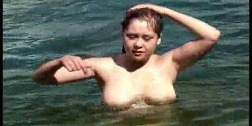 Beautiful girl sexy swim in the lake