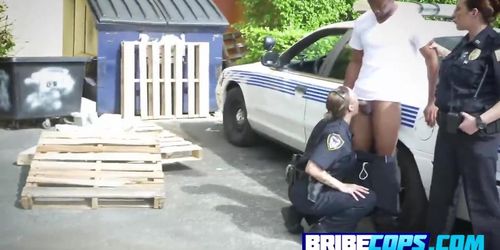 Horny cops get bang outdoors by a big black fat dick next to a police car