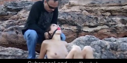 Brunette teen hard trained for submission in a rocky spot