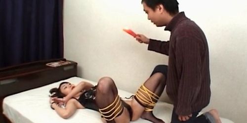 Asian hooker in fishnet gets wax dripped on her sex body
