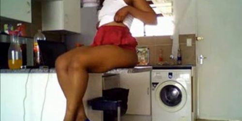 Sexy ebony girl with juicy ass teasing in kitchen