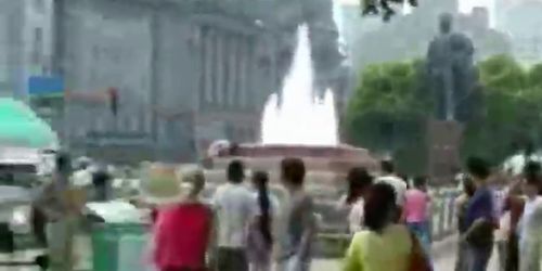 Woman bathing in public fountain