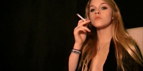 Sexy Blonde smokes and displays her tits