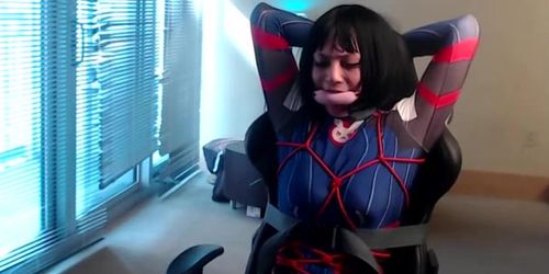 Crossdresser in D.Va bodysuit tied to a gaming chair (Part 3)