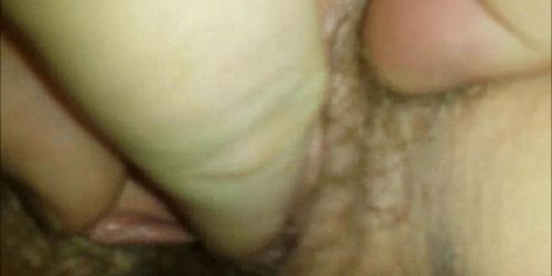 Giving oral sex to a hairy pussy