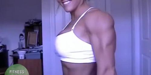 Muscle girl Cindy Phillips posing and flexing her ripped body on webcam