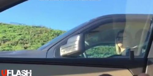 blonde watches flasher in traffic