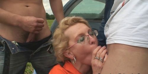 GRANDMA FRIENDS - Old bitch swallows two cocks outdoors