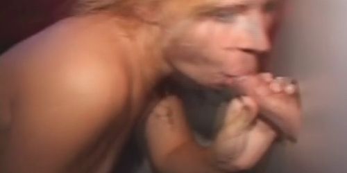 Blonde On Her Knees Sucking Dick Through A Glory Hole