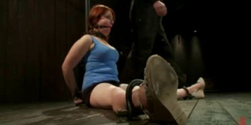 Immobilized gagged redhead babe gets lashed in dungeon