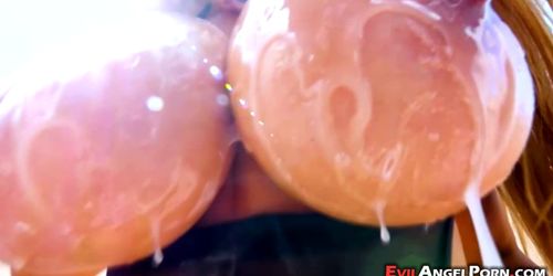 Kianna Dior wanks a dong with her lubed bazongas (Jonni Darkko)
