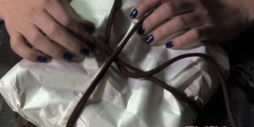 Gagged sub inserts her kinky present