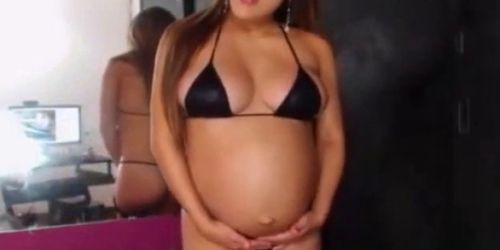 Big Pregnant Girl Overcome with Belly Contractions