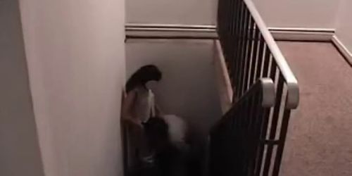 Sex with brunette on the stairs of the hall