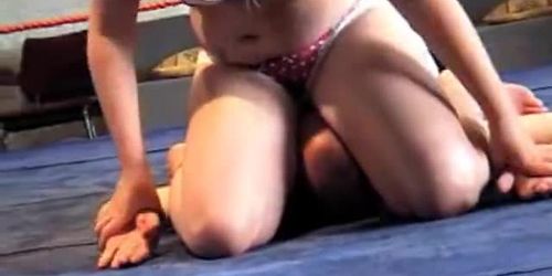 Mixed facesitting smother in a wrestling ring