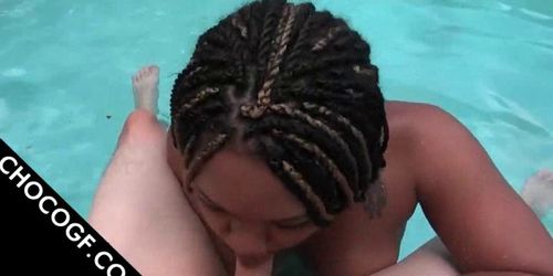 Tattooed Choco slut sucking dick by the pool