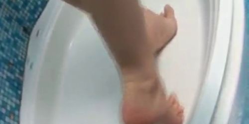 Super chick soaping body in the shower