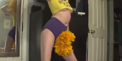 SEXY REDHEADED CHEERLEADER strips down in front of the MIRROR!