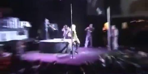 Blonde female stripper abuses a dildo