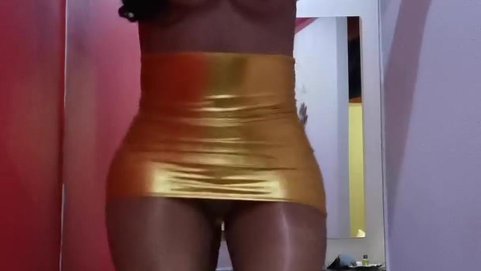Silicone female mask dancing in Gold minidress